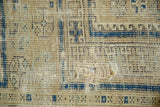 Exposed handwoven foundation with remnants of navy geometric pattern on an antique Caucasian rug.