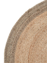 Handmade hemp rug texture with natural beige fibers and a subtle pewter border.