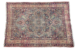 Antique Lavar Kerman rug, distressed floral medallion, cypress trees, rose and blue on tan.