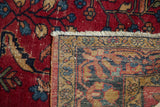 Vintage Persian Lilihan rug with cherry red floral pile and hand knotted foundation.