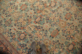 Antique Mahal rug's rare green ground, allover Veramin floral pattern, and time-softened abrashes, with feet.