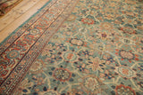 Antique Mahal carpet's Veramin field design showcasing rare green ground and vibrant abrashes.