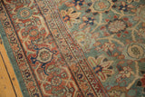 Ornate madder root red border and celadon green Veramin field on the antique Persian Mahal carpet.