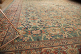 Patinaed antique Mahal carpet with rare green ground, Veramin allover design, and madder red borders.