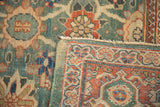 Antique Mahal rug folded corner, showcasing rare green ground, Veramin pattern, madder red border.