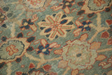 Antique Mahal rug detail: Veramin floral design, time-softened celadon, ivory, and red.