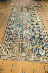 Visible wear and triple column boteh motifs on antique Caucasian runner with mauve, pale gold.