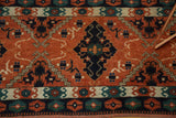 Afghan tent runner: dramatic navy diamond medallion on terra cotta, framed by geometric and curvilinear patterns.