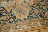 Vintage Tajabad rug border and field detail, showcasing geometric patterns, soft beige, blush, teal, and storied repairs.