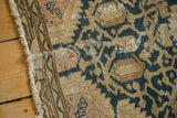 Vintage Tajabad rug detail: hand-knotted texture, teal blue pattern, and visible surface loss.