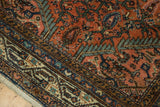 Intricate Persian Tajabad rug patterns, hand-knotted in blush, sky blue, and abrashed copper green wool.
