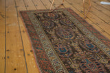 Hand-knotted allover boteh motif with haloed plants in charcoal, teal, and madder red.
