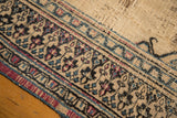 Antique Doroksh rug border, exposed plain weave with navy, sky blue, and mauve floral motifs.