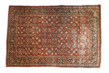 Vintage Mahal carpet with allover floral pomegranate trellis pattern in cherry red, navy, ivory.
