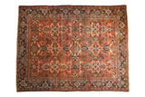 Hand-knotted vintage Mahalati carpet with allover terra cotta rust field, palmettes and lotus flowers.