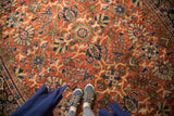 Vintage Mahalati rug with allover palmette and lotus flower pattern in rich rust and blue.