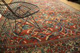 Persian Mahal carpet's curvilinear design featuring brick red rust and sky blue motifs.