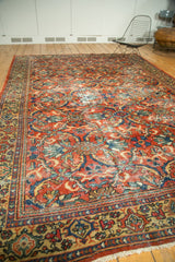 Mahal carpet corner showing brick red rust field with contoured leaves and multi-layered border.