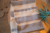 Handwoven Loomination gray and natural horizontal striped cotton dish towel.