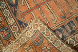 Antique Kurdish rug fold revealing tatter to ends, light foundation, and hand-knotted weave.
