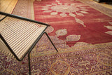 Vintage Amritsar carpet's wine red field, quarter spandrel, cartouche border, and even wear.