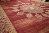Vintage Amritsar carpet with ornate mauve finials on a time-softened wine red field.