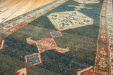Vintage Kurdish Bijar runner's abrashed slate blue field with geometric samovar motifs.