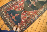 Vintage Kurdish Bijar runner's geometric patterns, abrashed pile, and macram fringe.