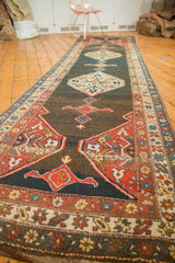 Angled Vintage Kurdish Bijar runner, double diamond medallions on abrashed charcoal blue field.
