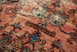 Intricate design and signature cartouche with raspberry red and sapphire blue abrashes on an antique Lilihan rug.