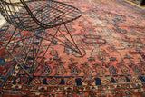 Antique Lilihan carpet with blush field, sapphire blue floral motifs, and time-softened patina.