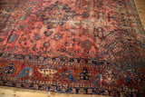 Raspberry main field with delicate vinery and sapphire blue abrash on an antique Lilihan.