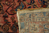 Antique Lilihan carpet pile in raspberry and blue, revealing hand knotted foundation and fringe.