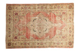 Antique Kerman rug with a trefoil medallion, cochineal red field, and ivory floral palmette borders.