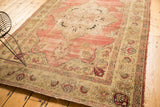 Antique Kerman rug with trefoil medallion, floral palmettes, and faded cochineal red.