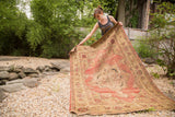 Antique hand-knotted Kerman rug, trefoil medallion and blooming cochineal floral palmettes.