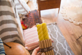 Pair of bamboo green beeswax rope taper candles, twisted design, ribbed packaging.