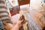 Cream beeswax rope taper candles with textured design, 10 inches tall.