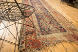Antique Kurdish Hamadan runner end with indigo field, red border, boteh motifs, worn fringe.