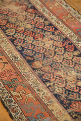 Kurdish Hamadan runner's indigo boteh field and geometric terracotta border.