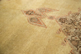 Vintage Tabriz carpet's unusual pale gold field with serrated diamond and floral motifs, short pile.
