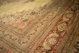 Vintage Tabriz carpet border with pale rust, brown, and saffron gold floral motifs.