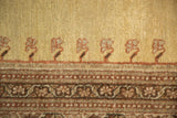 Hand knotted vintage Tabriz rug's unusual pale gold field with rust motifs and chocolate border.