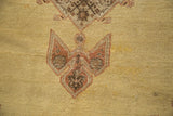 Pale saffron gold field with serrated pale rust and chocolate brown floral pattern.