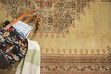 Vintage Tabriz carpet corner with unusual pale gold field and serrated floral medallion.
