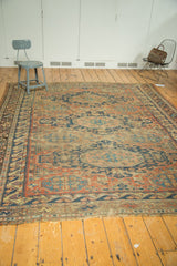 Antique Caucasian Soumac carpet showing exposed foundation, light tatter, and geometric border.
