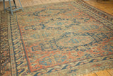 Antique Caucasian Soumac rug border with intricate geometric patterns, brick red, indigo, and visible wear.