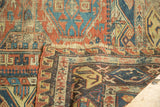 Geometric patterns and hand-knotted flatweave on a stabilized end of an antique Soumac carpet.