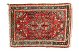 Vintage Hamadan rug: diminutive center medallion, allover florals; cherry red, sky blue, teal, ivory.