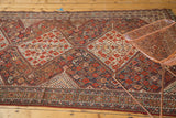 Antique Shiraz tribal carpet with geometric patterns, deep reds, navy, ivory, and even wear patina.